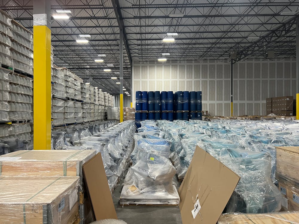 Warehouse pallets of liquidated goods stacked and ready for sorting